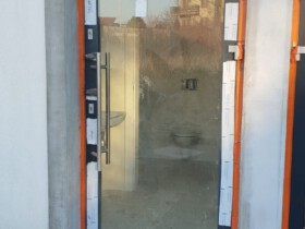door in the process of casing after installation facade of the house